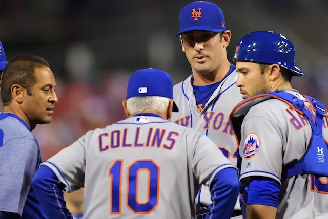 Matt Harvey, catcher Travis d'Arnaud, manager Terry Collins and trainer Rey Ramirez discuss the best ways to get over heartbreak at a meeting on the mound.